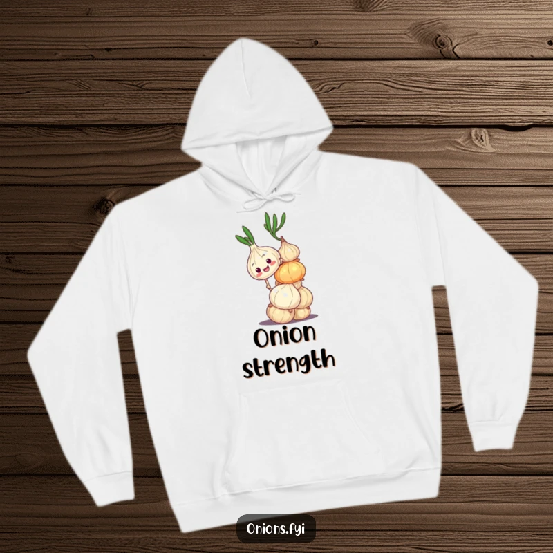Funny hoodie with an onion character climbing a wobbly stack, offering warmth and a humorous take on perseverance. Ideal gift.
